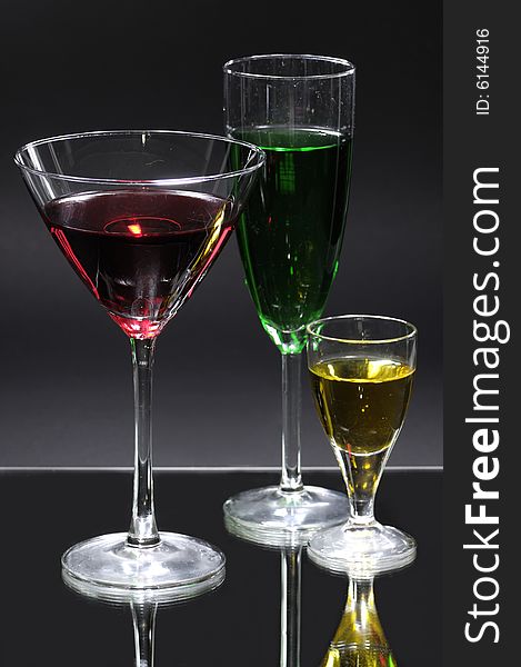 Colourful cocktails on black background