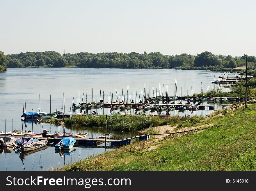 landscape with fishing boats by the river (Vistula River/Poland). landscape with fishing boats by the river (Vistula River/Poland)