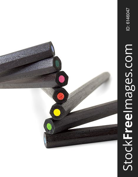 Black wooden pencils of different color creating a semicircle spiral. Black wooden pencils of different color creating a semicircle spiral
