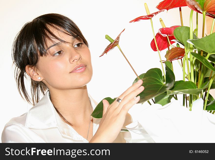 Young beautiful woman with red flowers. A series