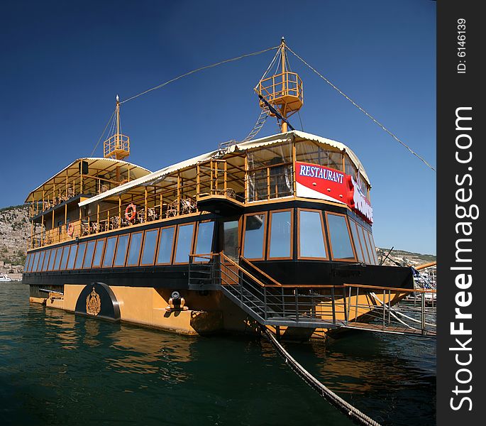 Restaurant on water in the form of the ancient ship