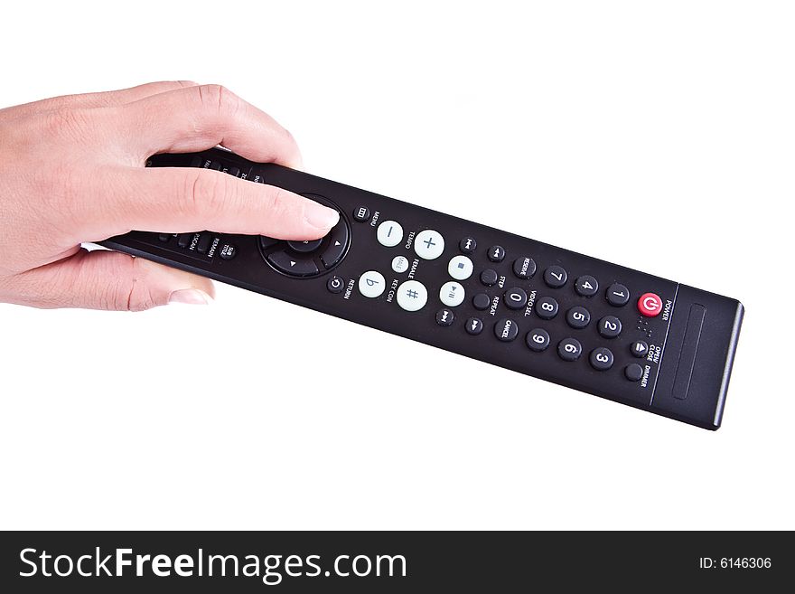 Female hand with a remote control.