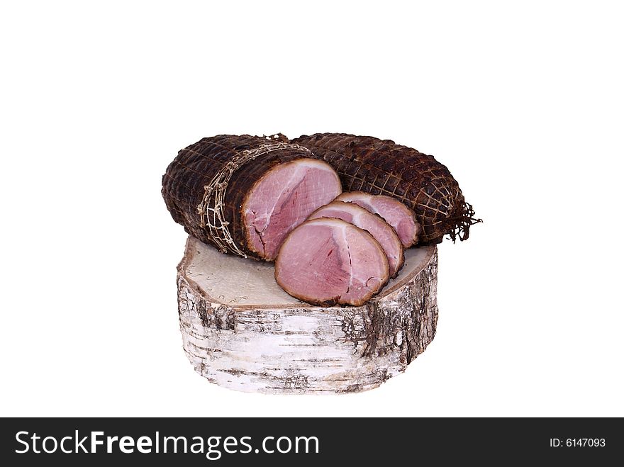 Ham lying on birch stump isolated on white background. Ham lying on birch stump isolated on white background