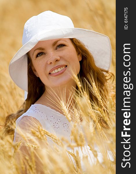 Beautiful woman in wheat field at sunny day. Beautiful woman in wheat field at sunny day