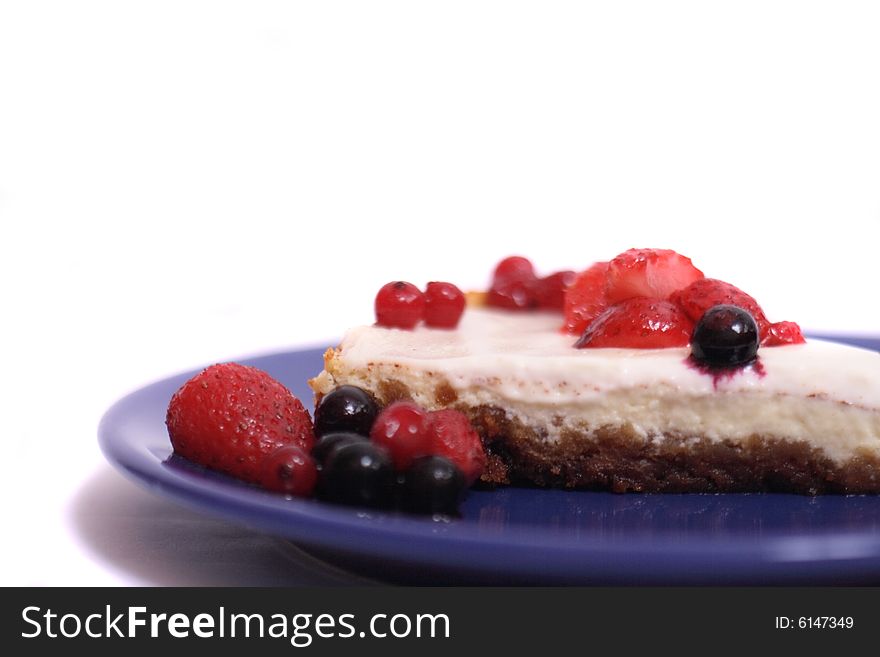 Cheesecake with fruits on the white background