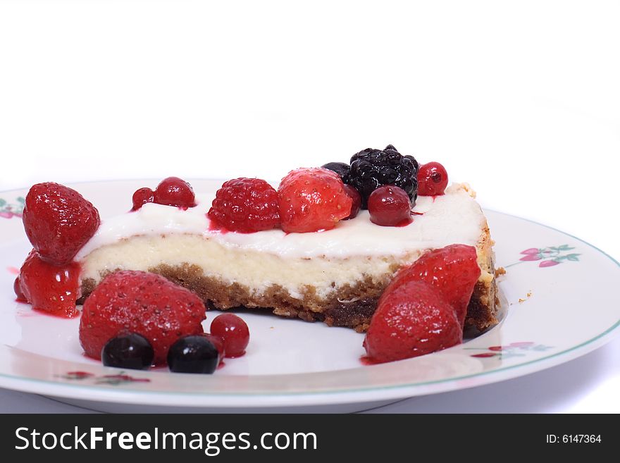 Cheesecake with fruits on the white background