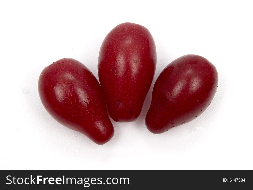 Red exotic berries on white background