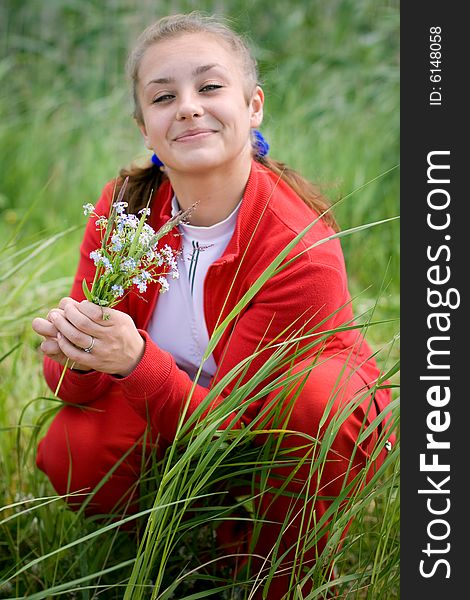 Beautiful smiling girl gathering flowers. #2. Beautiful smiling girl gathering flowers. #2