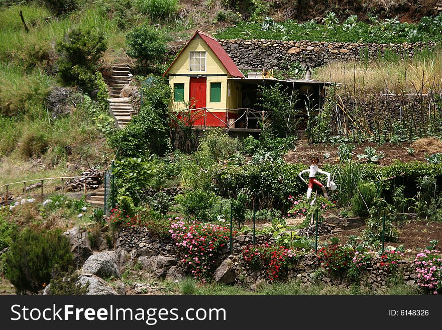 This little yellow-red coloured house with its romantic garden is to find on a hill on the portuguese isle of Madeira. This little yellow-red coloured house with its romantic garden is to find on a hill on the portuguese isle of Madeira.
