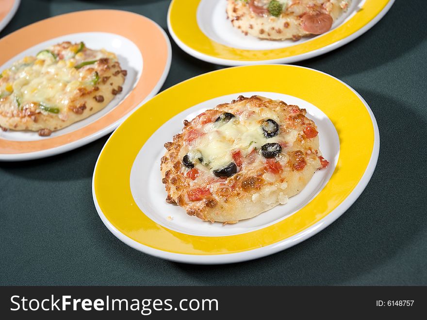 Several little and individual pizzas. Several little and individual pizzas