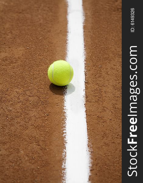 Tennis ball and white line