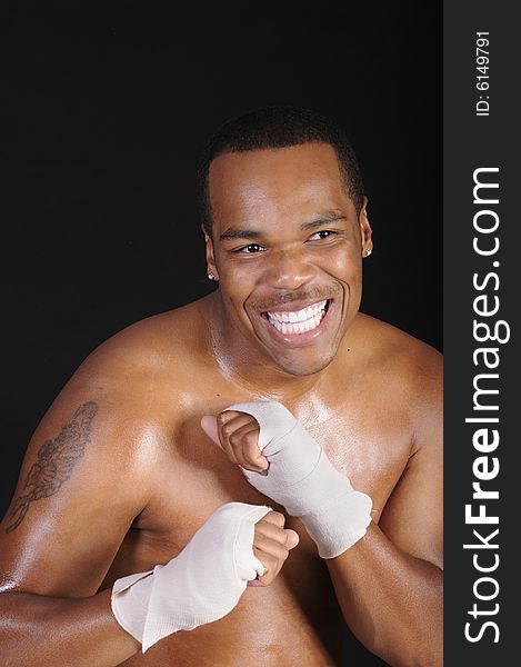 Smiling young African American boxer during workoput