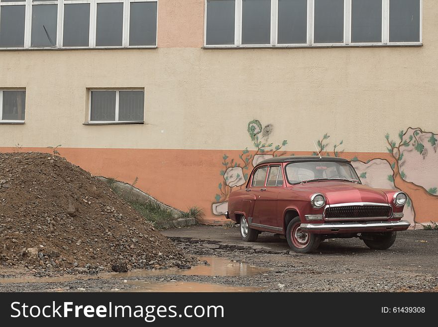 Old restored vintage classic car in an urban environment