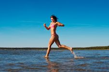 Woman Runnig In Water Stock Photography Woman Runnig In Water Stock Photography