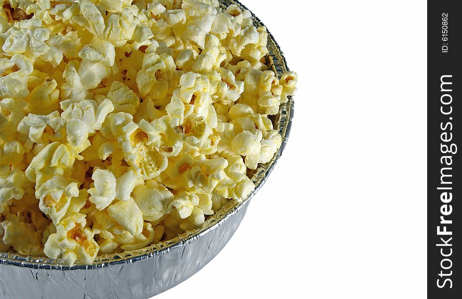 Freshly popped popcorn in an aluminum bowl. Freshly popped popcorn in an aluminum bowl.