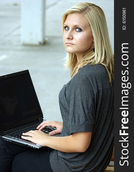 Young, Blonde Girl With Laptop