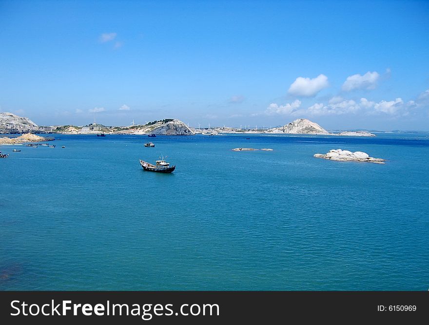 Under blue color sky and many boats on sea. Under blue color sky and many boats on sea