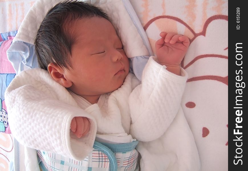 Sleeping Baby on a bed