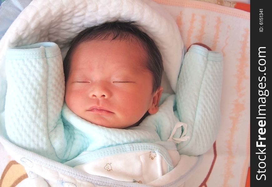 Sleeping Baby on a bed