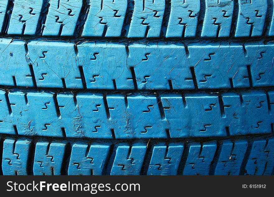 Old used blue tyre for background. Old used blue tyre for background