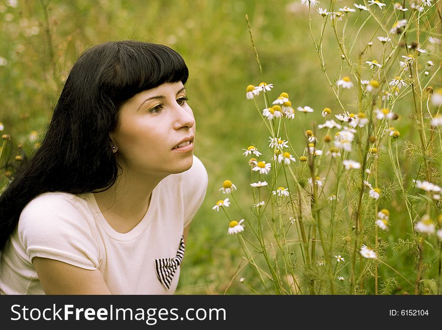 Girl relaxing on a meadow