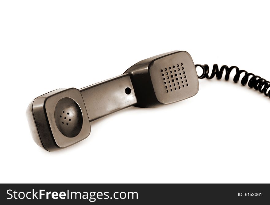 Old style telephone receiver isolated on a white background