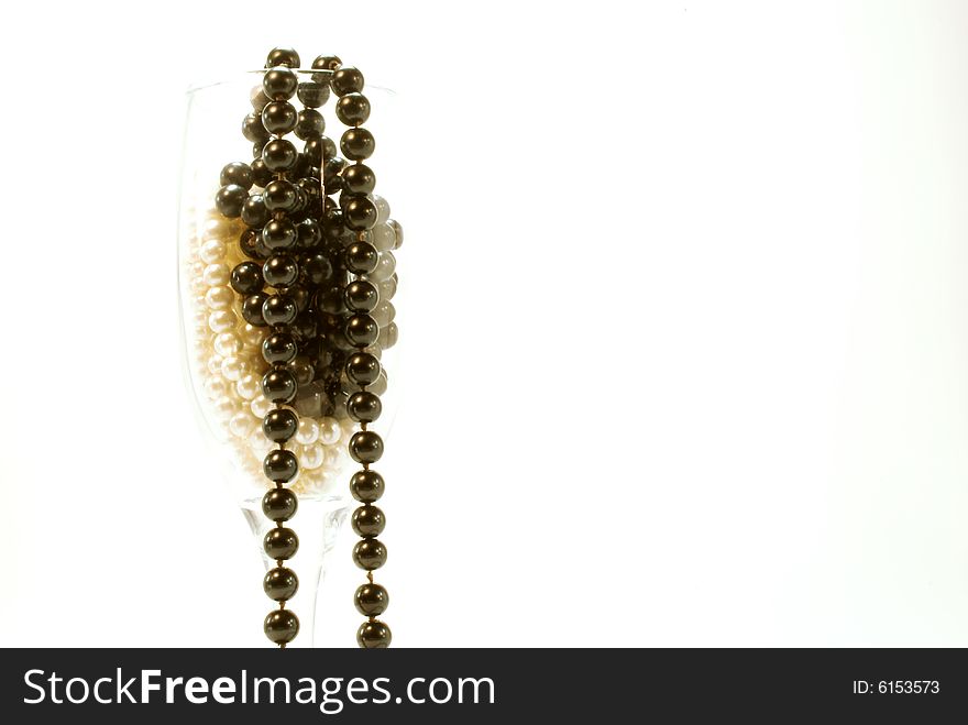 The glass with black and white beads. The glass with black and white beads