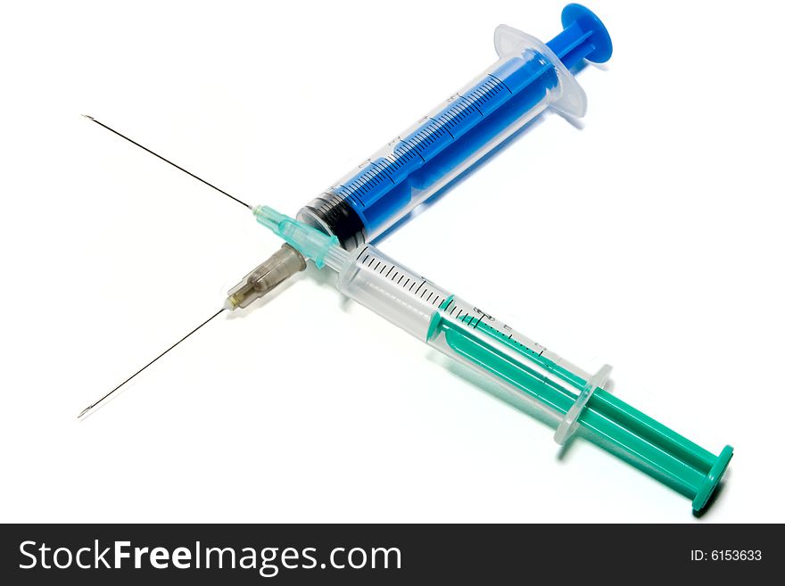 Syringe cross isolated over white.