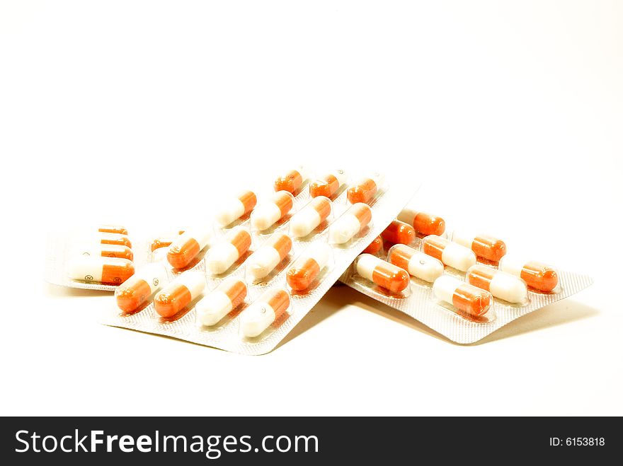 Three packs of tablets on white background