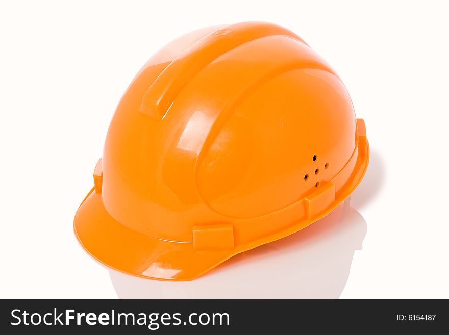 Isolated orange building helmet, white background. Isolated orange building helmet, white background