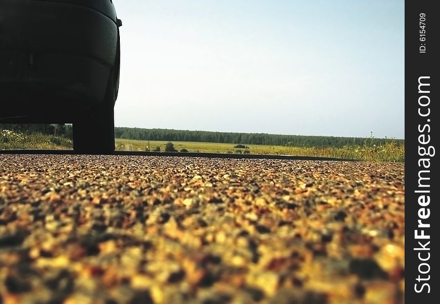 Country landscape and the car on country road