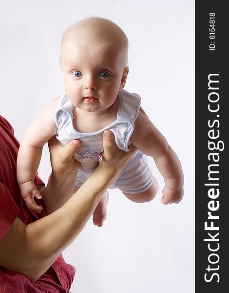 Pretty baby with blue eyes  on father`s hands. Pretty baby with blue eyes  on father`s hands