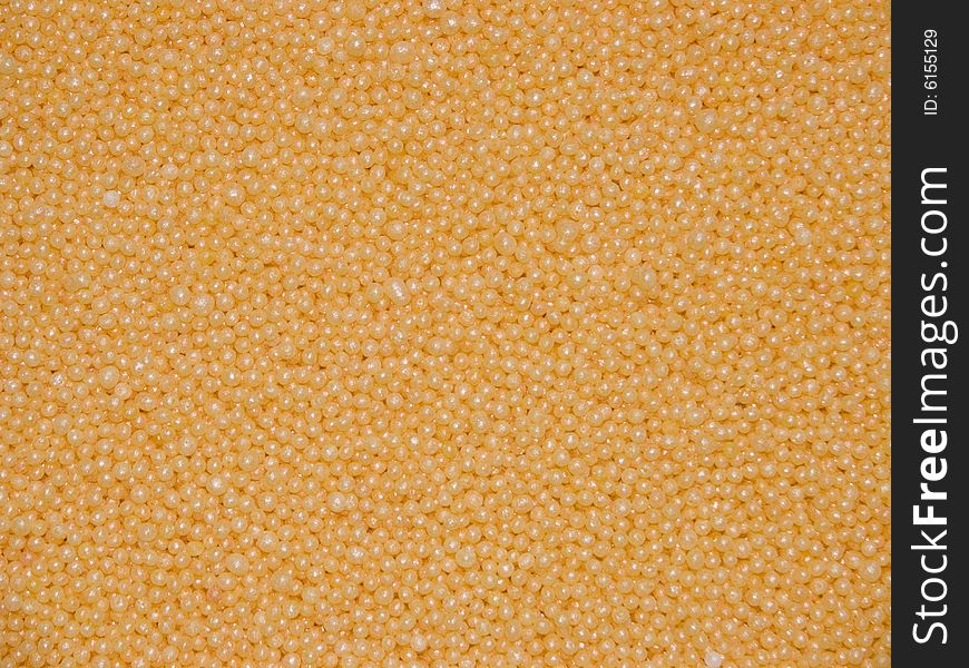 A background consisting of small granules of yellow colour. A background consisting of small granules of yellow colour