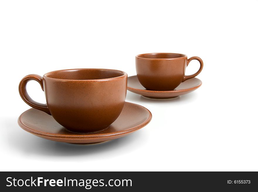 Coffee cups and saucers isolated on white background. Coffee cups and saucers isolated on white background