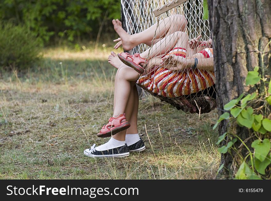 Little girls legs on a hammock