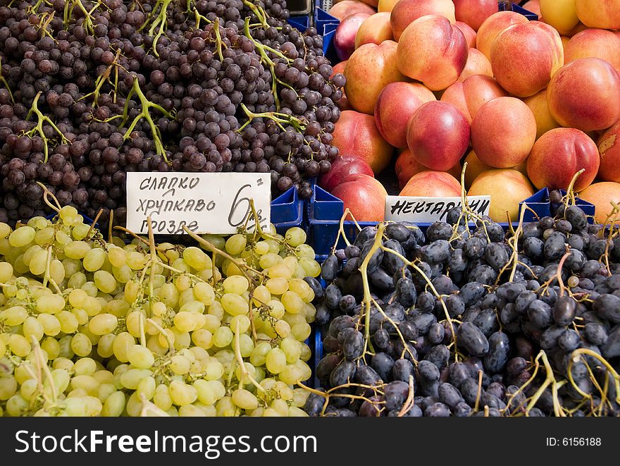 Grapes and nectarines on a market. Grapes and nectarines on a market