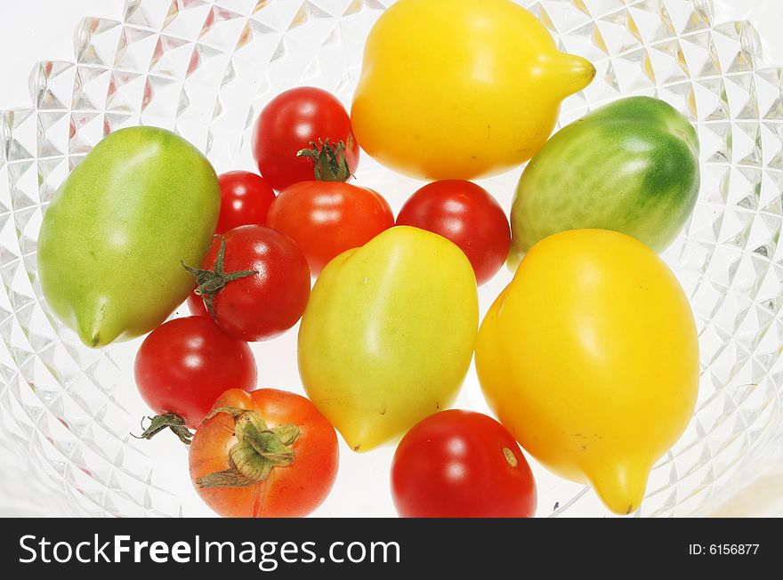 Colorful tomatoes in a glass bowl. Colorful tomatoes in a glass bowl