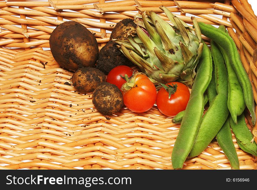 Freshly picked garden vegetables in a basket. Freshly picked garden vegetables in a basket