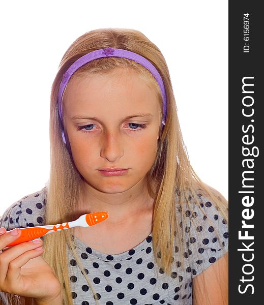 Young teenager girl cleaning tooth