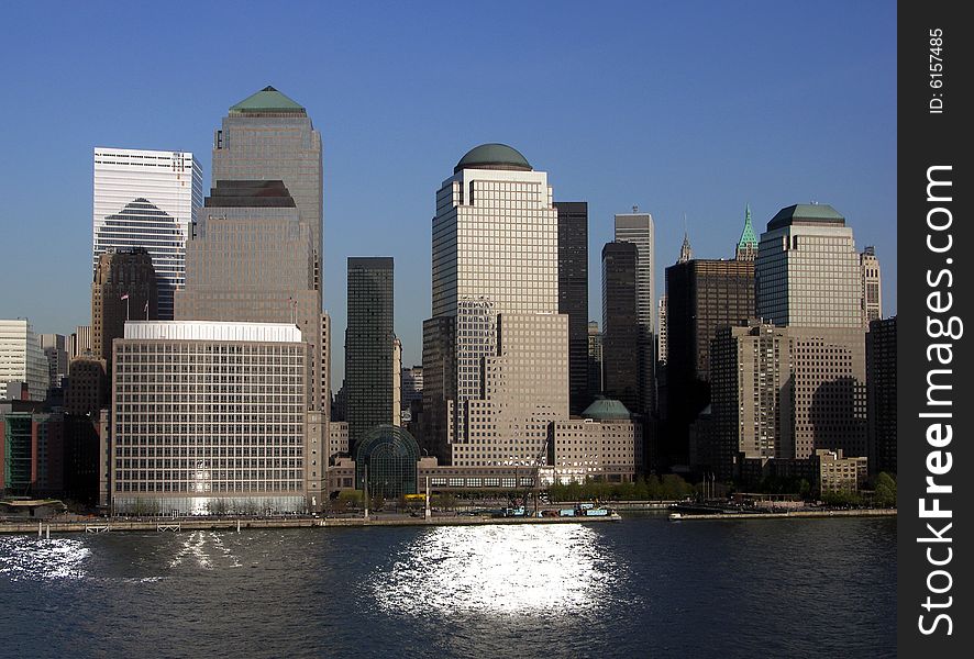 The view of futuristic looking skyscrapers with sunlight reflections in Manhattan, New york City. The view of futuristic looking skyscrapers with sunlight reflections in Manhattan, New york City.