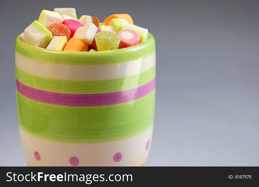 Decorative cup of candy party mix. Decorative cup of candy party mix