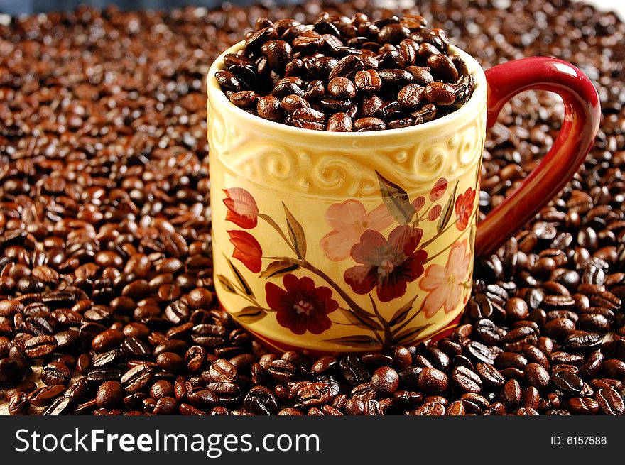 Coffee mug full of coffee beans. Coffee mug full of coffee beans