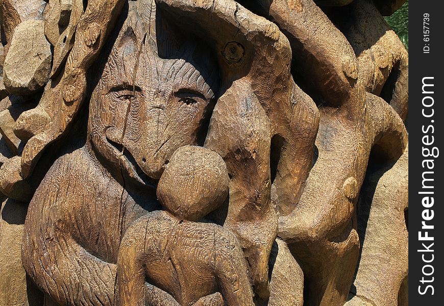 A wooden carving of a wolf, carved into a totem pole. A wooden carving of a wolf, carved into a totem pole.