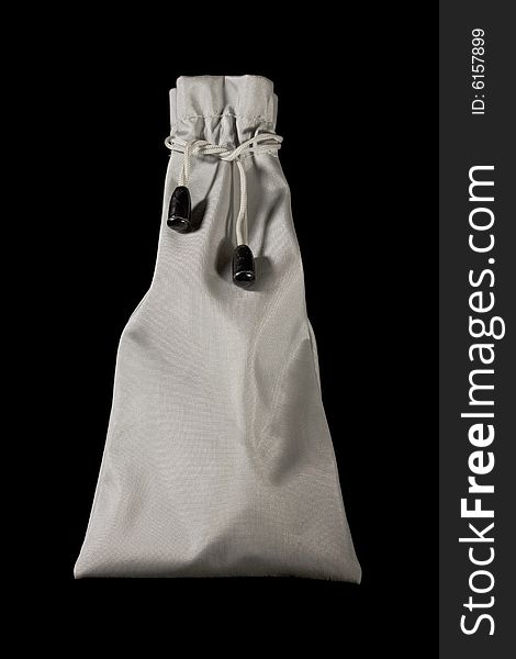 Small grey crumpled pouch with strings tied round its neck. Small grey crumpled pouch with strings tied round its neck