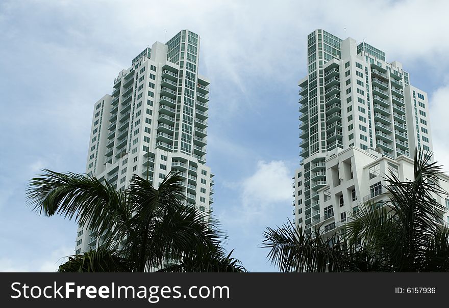 Luxurious condominiums with a cloudy blue sky in the background. Luxurious condominiums with a cloudy blue sky in the background