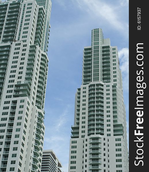 Two new construction towers with cloudy blue sky background. Two new construction towers with cloudy blue sky background