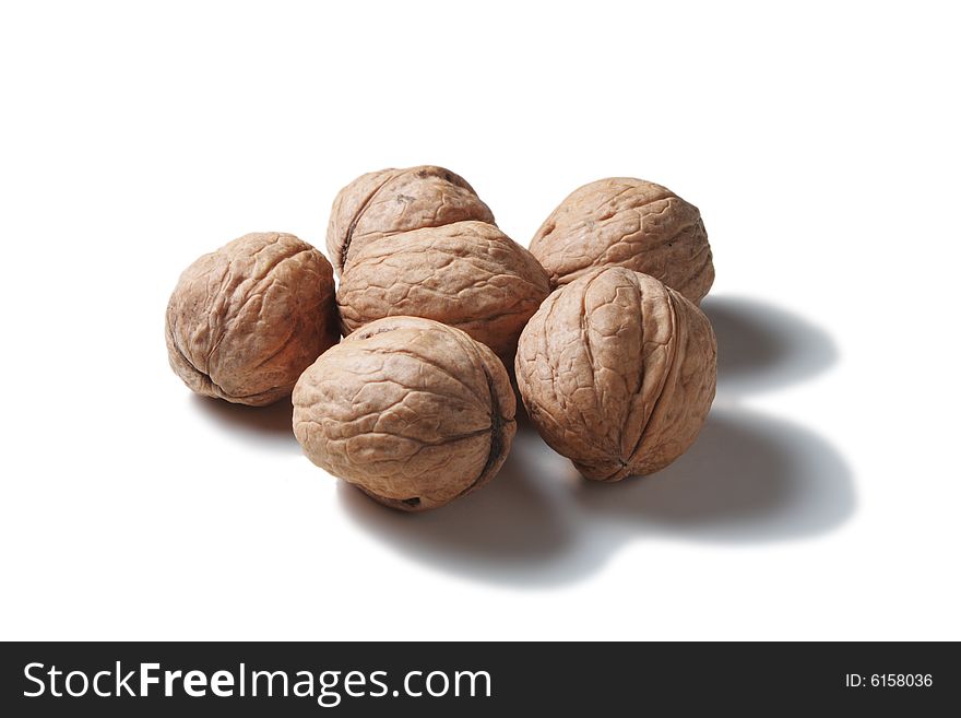 Five walnuts isolated on white background