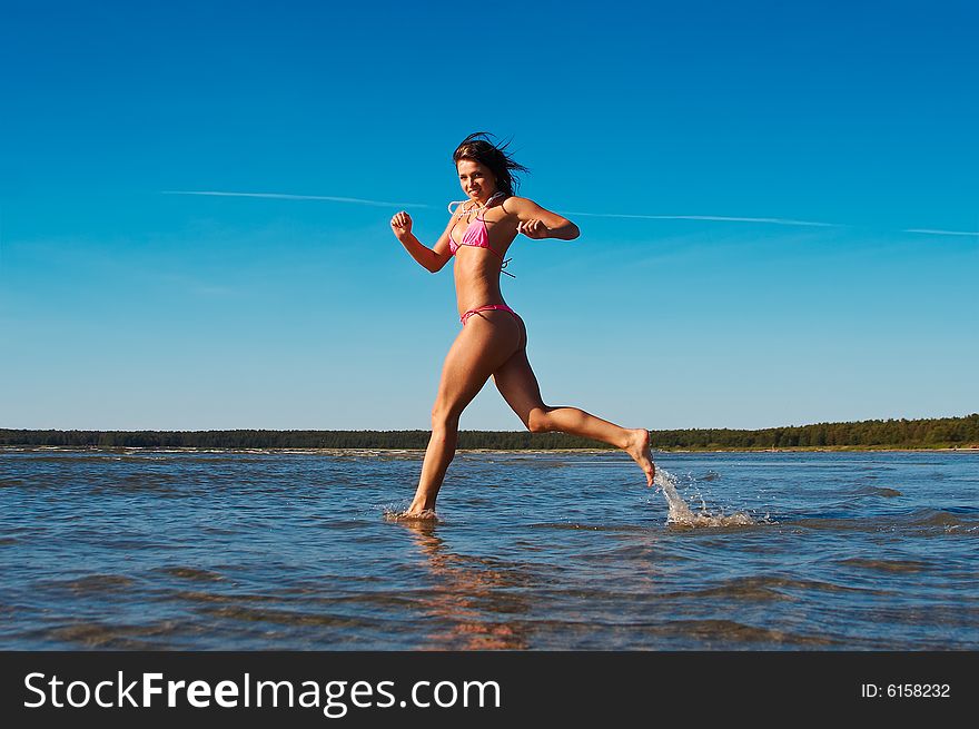 Woman Runnig In Water