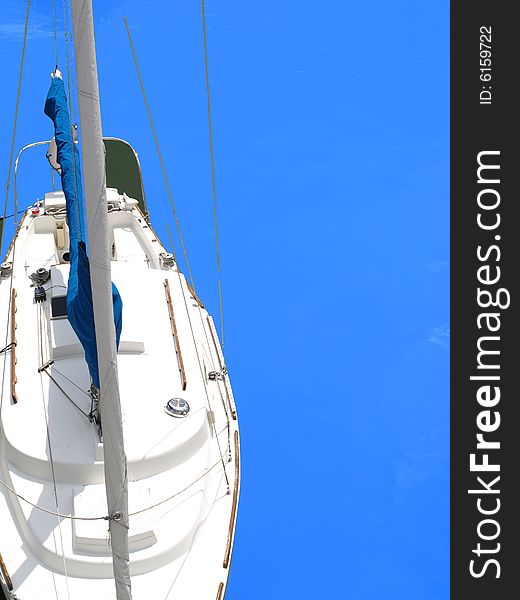 A sail boat over a blue background.