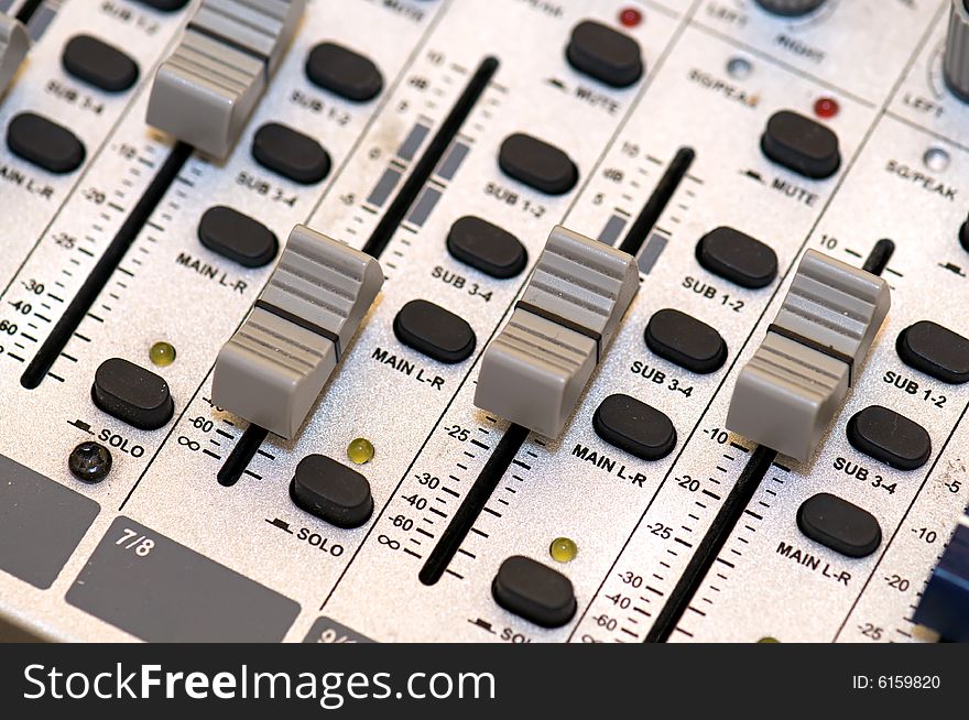 Closup on grey sound mixer station